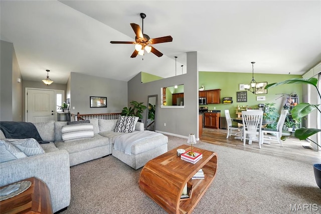 6346 Twin Springs Blvd, Cedar Hill, MO 63016 - living area with a chandelier, light colored carpet, ceiling fan, baseboards, and high vaulted ceiling