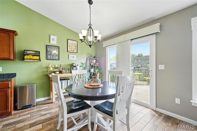 6346 Twin Springs Blvd, Cedar Hill, MO 63016 - dining room with light wood-type flooring, a chandelier, and baseboards