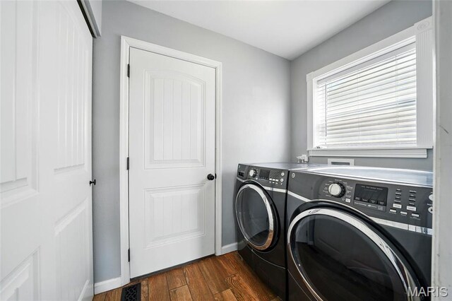 6346 Twin Springs Blvd, Cedar Hill, MO 63016 - washroom featuring washer and dryer, dark wood-type flooring, and baseboards