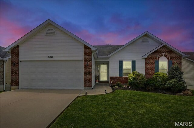 6346 Twin Springs Blvd, Cedar Hill, MO 63016 - ranch-style house featuring concrete driveway, brick siding, a front lawn, and a garage