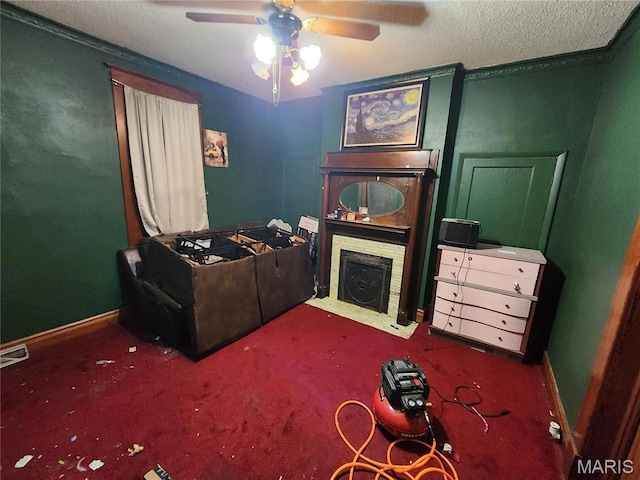 420 E 9th St, Alton, IL 62002 - interior space with a textured ceiling, a fireplace with flush hearth, ceiling fan, and baseboards