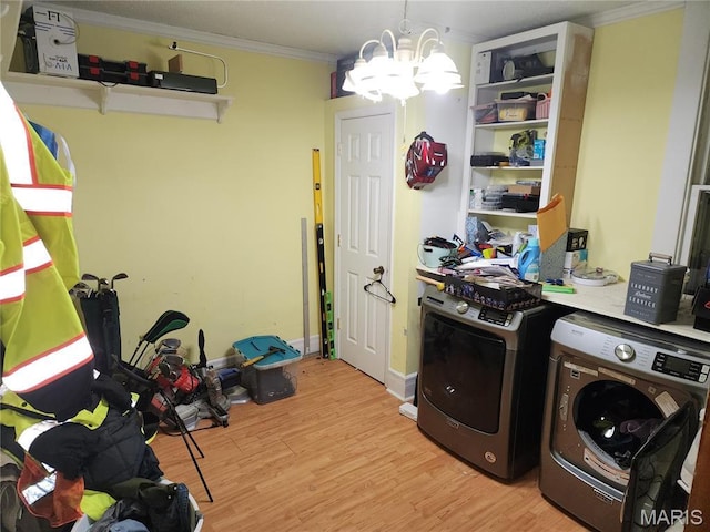 420 E 9th St, Alton, IL 62002 - laundry room featuring separate washer and dryer, crown molding, light wood-style floors, and a chandelier