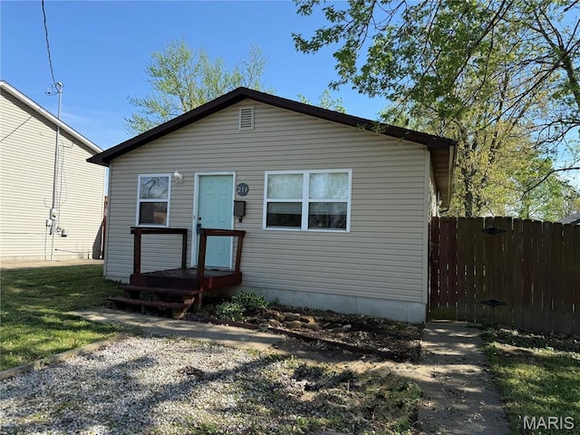 view of front of home featuring fence