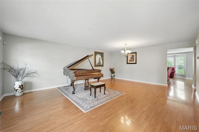 16816 Hickory Trails Ln, Wildwood, MO 63011 - living area with light wood-style floors, a chandelier, and baseboards