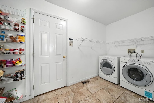 16816 Hickory Trails Ln, Wildwood, MO 63011 - laundry area with washer and clothes dryer and baseboards