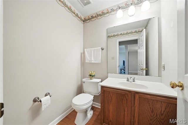 16816 Hickory Trails Ln, Wildwood, MO 63011 - bathroom with wood finished floors, toilet, vanity, and baseboards