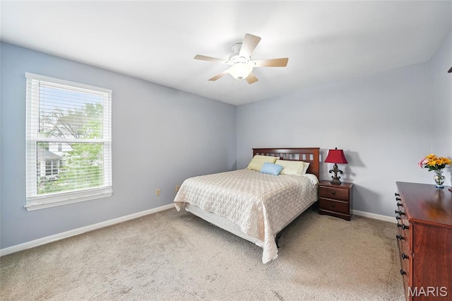 16816 Hickory Trails Ln, Wildwood, MO 63011 - carpeted bedroom featuring multiple windows, baseboards, and ceiling fan
