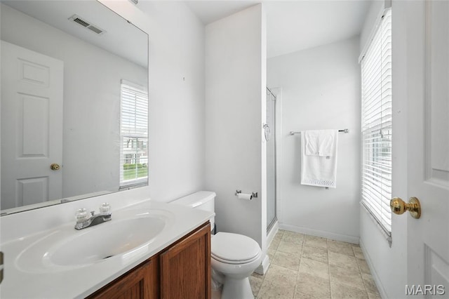 16816 Hickory Trails Ln, Wildwood, MO 63011 - bathroom with toilet, a shower with shower door, vanity, and baseboards