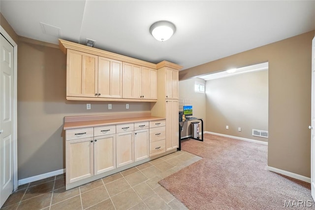 16816 Hickory Trails Ln, Wildwood, MO 63011 - kitchen with light brown cabinets, light countertops, baseboards, and light tile patterned flooring