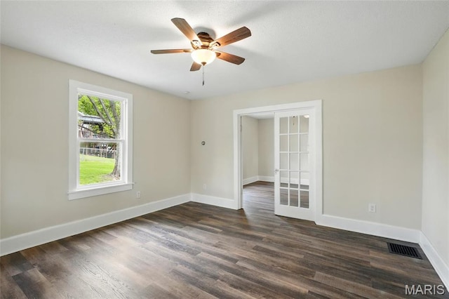 1242 Crystal Heights Rd, Crystal City, MO 63019 - empty room with a ceiling fan, dark wood-style floors, baseboards, and french doors