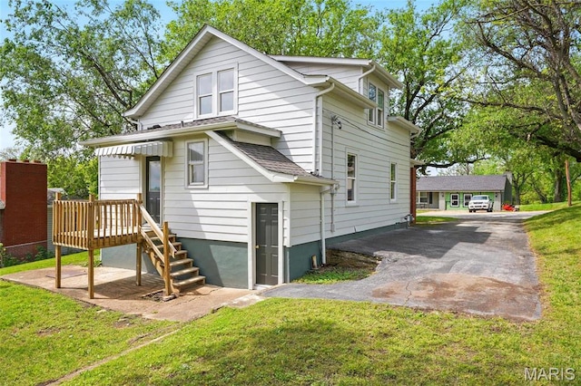 1242 Crystal Heights Rd, Crystal City, MO 63019 - rear view of house featuring a lawn