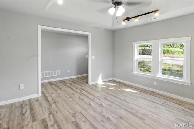 619 E 3rd St, De Soto, MO 63020 - empty room featuring ceiling fan, light wood-style flooring, and baseboards