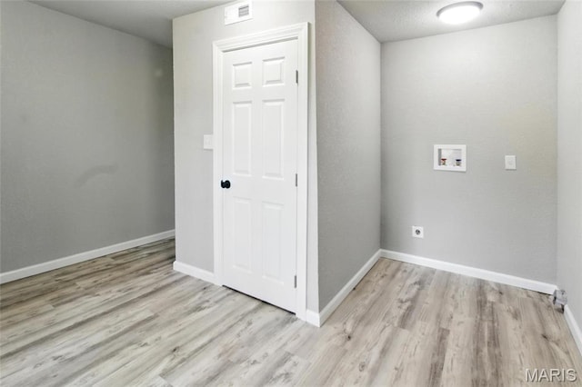 619 E 3rd St, De Soto, MO 63020 - washroom with washer hookup, wood finished floors, baseboards, and hookup for an electric dryer