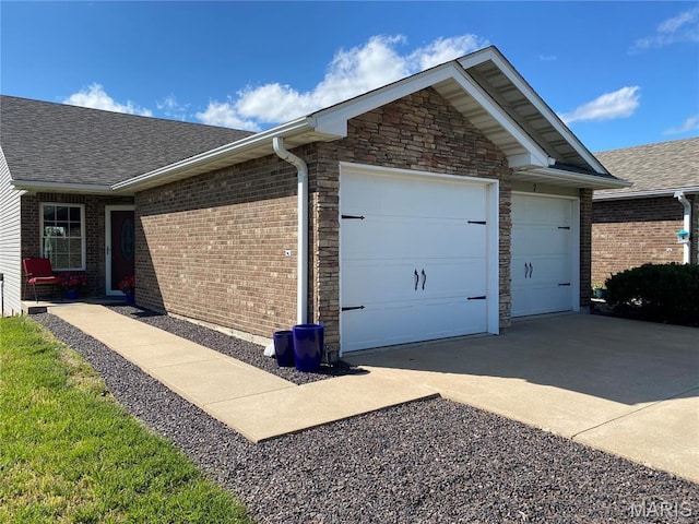 7 Chester Rd, Hannibal, MO 63401 - view of home's exterior with concrete driveway, a shingled roof, an attached garage, brick siding, and stone siding