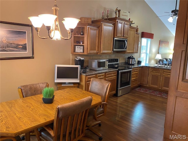 7 Chester Rd, Hannibal, MO 63401 - kitchen with appliances with stainless steel finishes, dark countertops, dark wood finished floors, a ceiling fan, and a chandelier