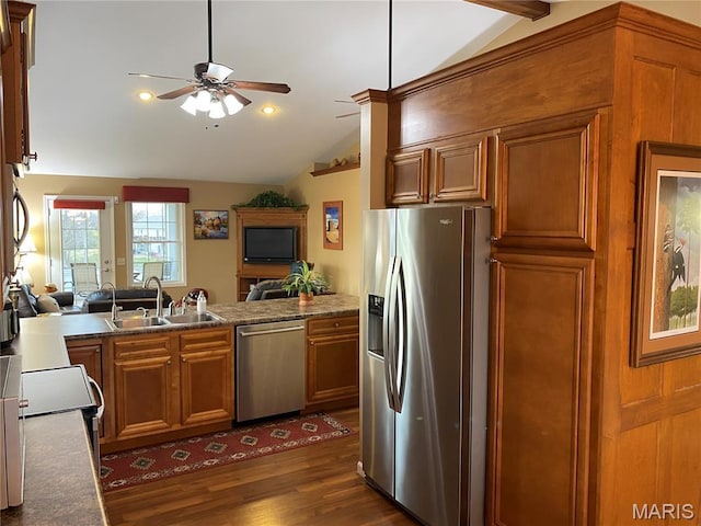 7 Chester Rd, Hannibal, MO 63401 - kitchen with appliances with stainless steel finishes, lofted ceiling, ceiling fan, brown cabinets, and a sink