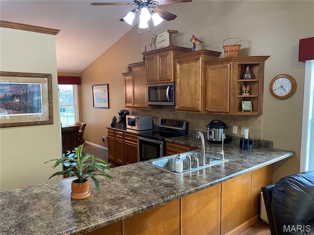 7 Chester Rd, Hannibal, MO 63401 - kitchen with stainless steel appliances, a sink, lofted ceiling, ceiling fan, and brown cabinetry