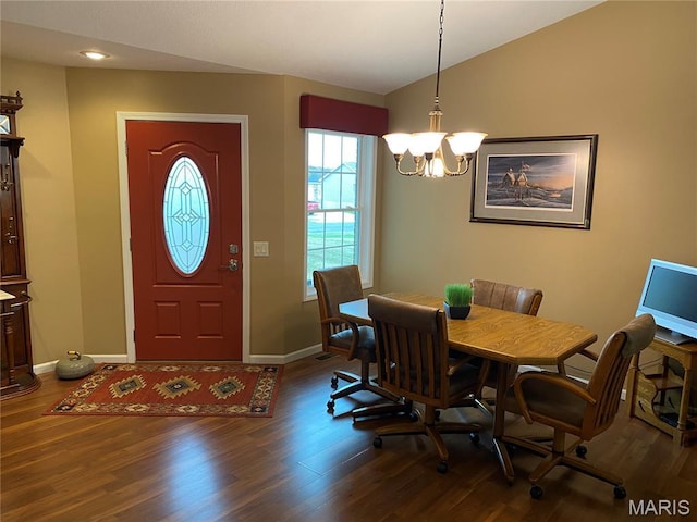 7 Chester Rd, Hannibal, MO 63401 - dining area with dark wood finished floors, a chandelier, baseboards, and vaulted ceiling