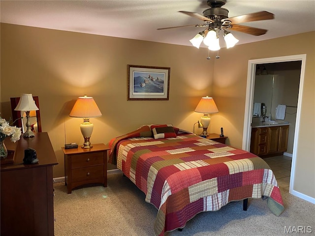 7 Chester Rd, Hannibal, MO 63401 - bedroom with a sink, light carpet, ensuite bathroom, ceiling fan, and baseboards
