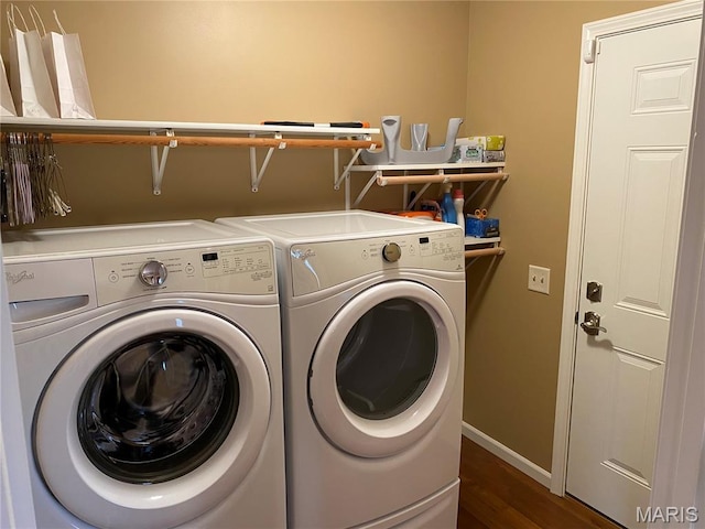 7 Chester Rd, Hannibal, MO 63401 - washroom with separate washer and dryer, dark wood-style flooring, and baseboards