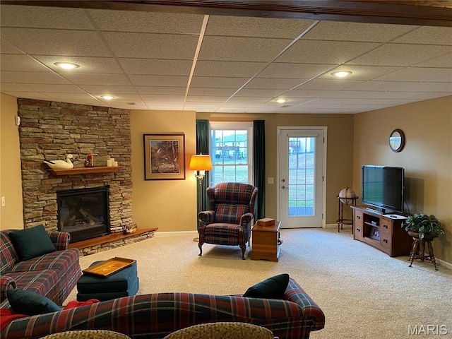 7 Chester Rd, Hannibal, MO 63401 - carpeted living room with baseboards, a drop ceiling, and a fireplace
