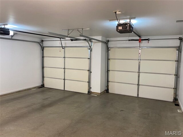7 Chester Rd, Hannibal, MO 63401 - garage with a garage door opener and baseboards