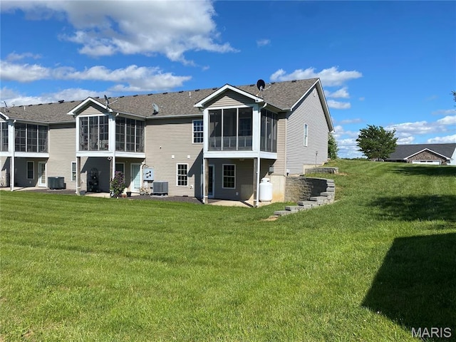 7 Chester Rd, Hannibal, MO 63401 - back of property featuring a sunroom, central AC, and a yard