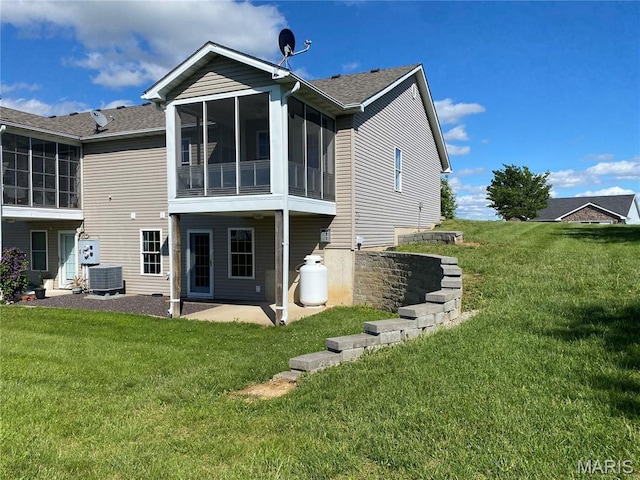 7 Chester Rd, Hannibal, MO 63401 - rear view of house featuring a sunroom, a patio, a lawn, and roof with shingles