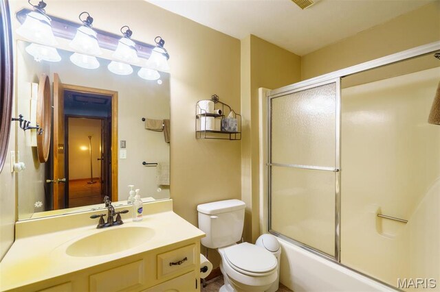 10280 County Road 3110, Rolla, MO 65401 - full bathroom featuring vanity, toilet, and combined bath / shower with glass door