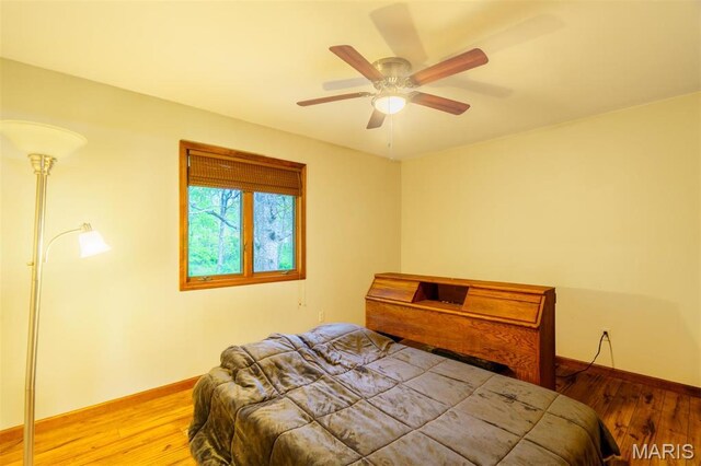 10280 County Road 3110, Rolla, MO 65401 - bedroom featuring wood finished floors, baseboards, and ceiling fan