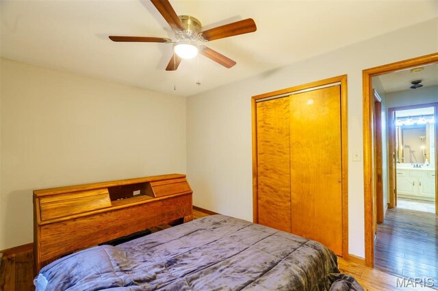 10280 County Road 3110, Rolla, MO 65401 - bedroom with wood finished floors, a closet, baseboards, and ceiling fan