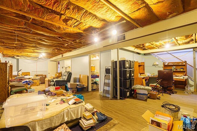 10280 County Road 3110, Rolla, MO 65401 - unfinished below grade area featuring wood finished floors and an office area