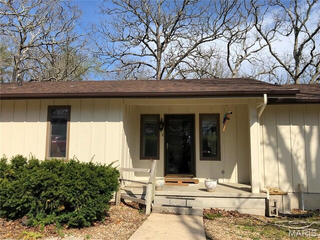 10280 County Road 3110, Rolla, MO 65401 - property entrance with a shingled roof and board and batten siding
