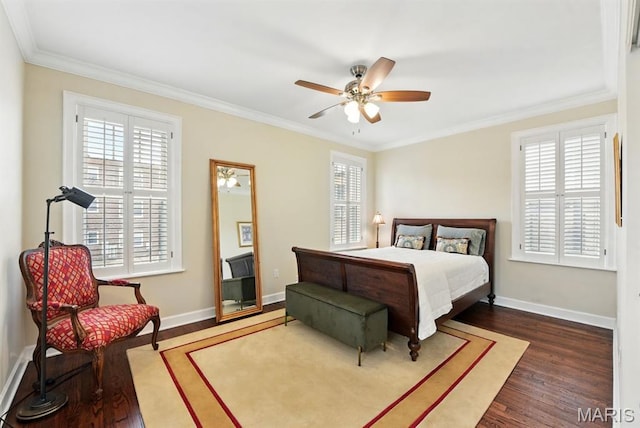 bedroom featuring dark wood-type flooring, multiple windows, ornamental molding, baseboards, and a ceiling fan