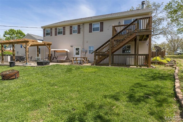 809 Cottage Rd, Bonne Terre, MO 63628 - rear view of house featuring a fire pit, stairs, a patio, a deck, and a yard