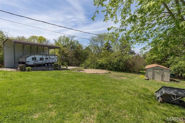 809 Cottage Rd, Bonne Terre, MO 63628 - view of grassy yard with a storage shed, an outbuilding, and a carport