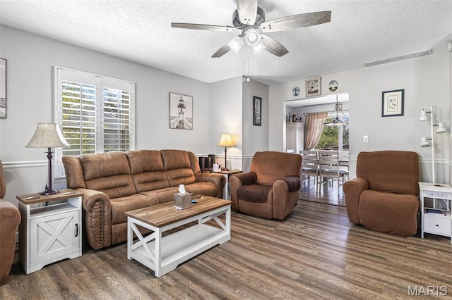 809 Cottage Rd, Bonne Terre, MO 63628 - living area featuring a textured ceiling, wood finished floors, healthy amount of natural light, and ceiling fan