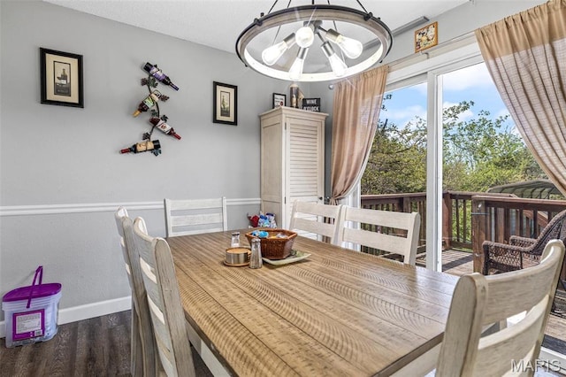 809 Cottage Rd, Bonne Terre, MO 63628 - dining space with wood finished floors, baseboards, and a chandelier