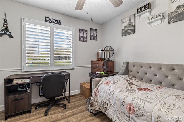 809 Cottage Rd, Bonne Terre, MO 63628 - bedroom with wood finished floors, a textured ceiling, ceiling fan, and baseboards