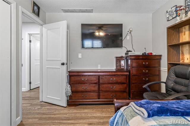 809 Cottage Rd, Bonne Terre, MO 63628 - bedroom featuring wood finished floors and a textured ceiling