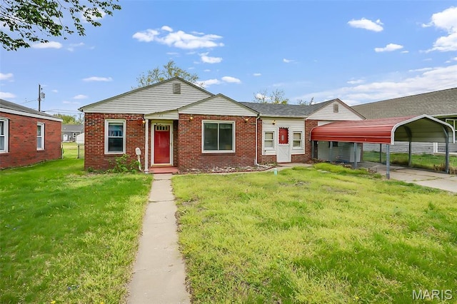 225 Whitelaw Ave, East Alton, IL 62024 - view of front of home featuring a detached carport, a front lawn, brick siding, and driveway
