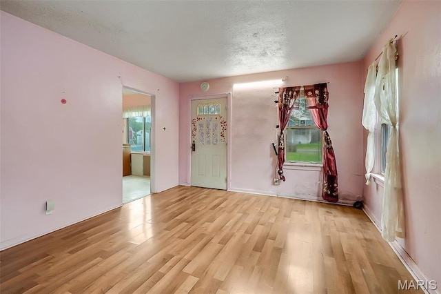 225 Whitelaw Ave, East Alton, IL 62024 - unfurnished room featuring healthy amount of natural light and light wood-type flooring