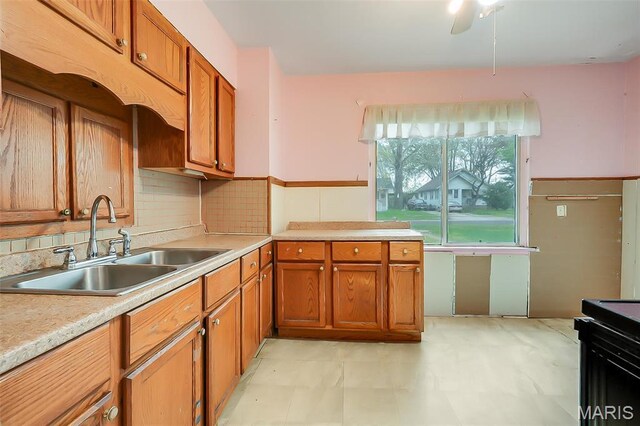 225 Whitelaw Ave, East Alton, IL 62024 - kitchen featuring a sink, brown cabinets, light countertops, and electric range