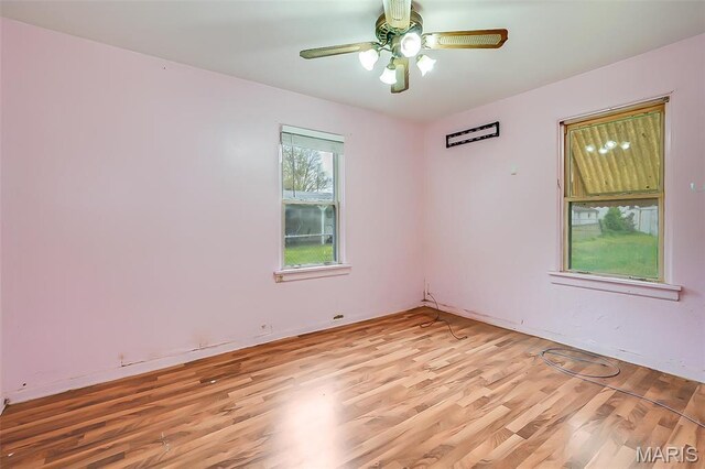 225 Whitelaw Ave, East Alton, IL 62024 - unfurnished room featuring light wood-style flooring and ceiling fan
