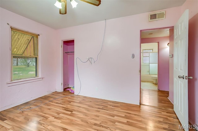 225 Whitelaw Ave, East Alton, IL 62024 - unfurnished bedroom with light wood-style flooring and ceiling fan