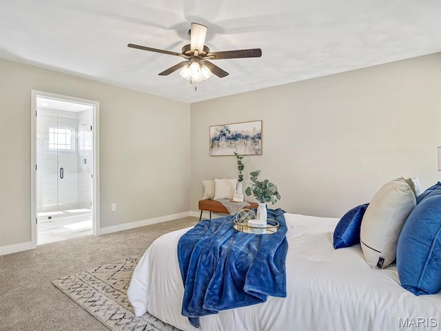 carpeted bedroom with connected bathroom, baseboards, and ceiling fan