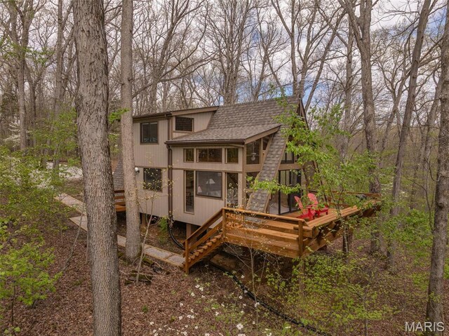 1556 Bliss Lake Dr, Innsbrook, MO 63390 - rear view of property with a shingled roof, a wooden deck, and stairway