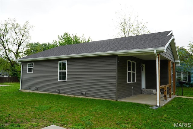 468 Polk St, Lebanon, MO 65536 - back of property with a patio area, a lawn, and roof with shingles