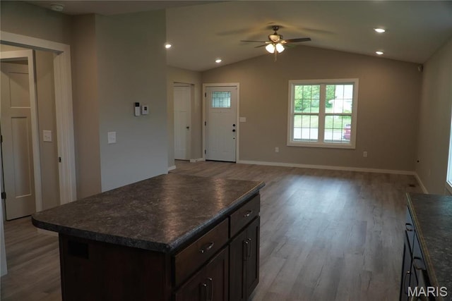 468 Polk St, Lebanon, MO 65536 - kitchen with dark countertops, ceiling fan, wood finished floors, dark brown cabinetry, and vaulted ceiling