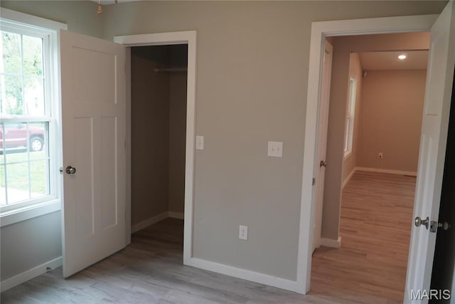 468 Polk St, Lebanon, MO 65536 - unfurnished bedroom featuring light wood-type flooring, baseboards, and a closet